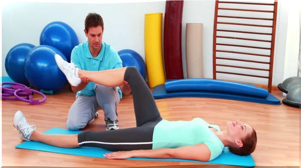 Woman practicing exercises with a physiotherapist.