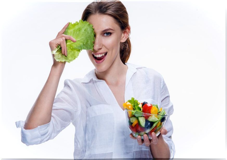 Woman with bowl of fruits and lettuce.