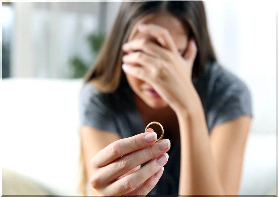 Crying woman with a ring in her hand