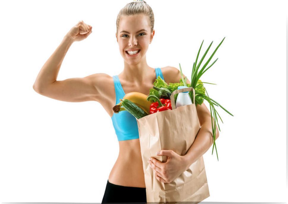 Woman contracting biceps and carrying a bag of vegetables.