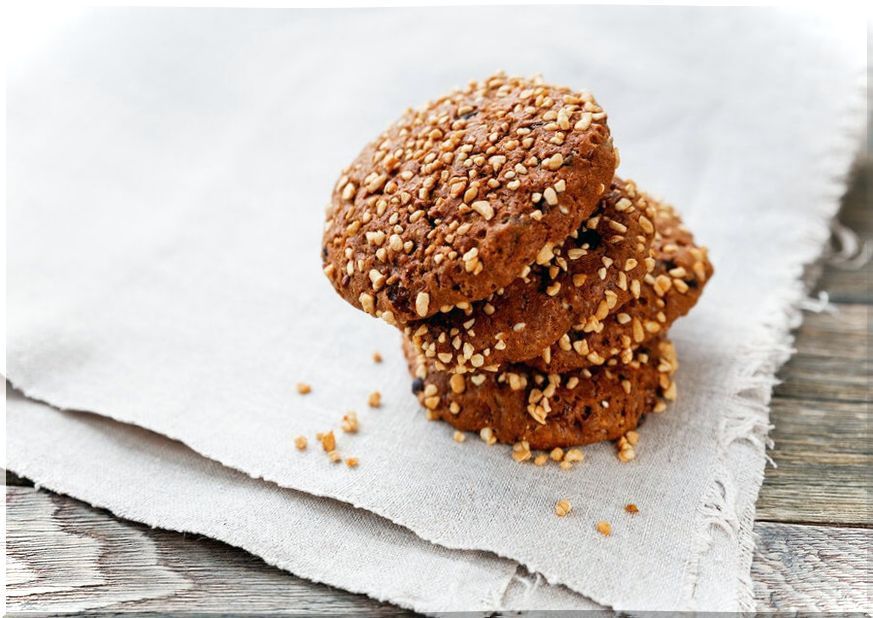 Pecan nut cookies on a napkin.