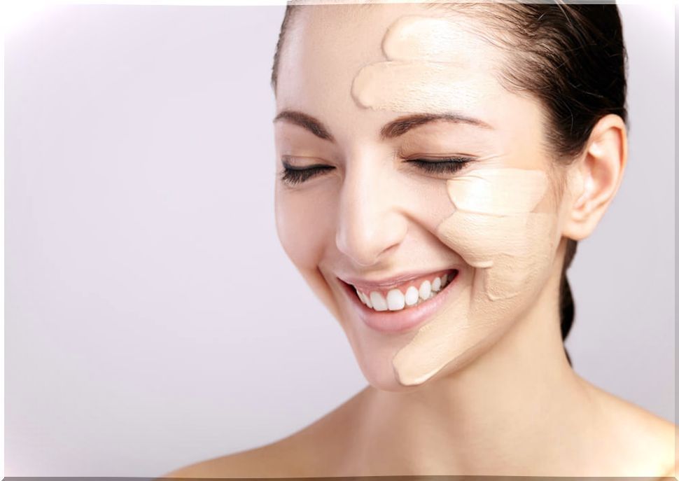 Woman with makeup on half face