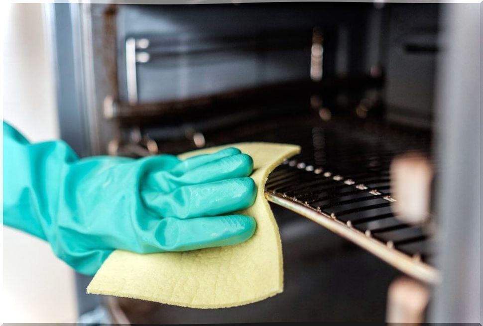 Clean the oven to remove the grease.