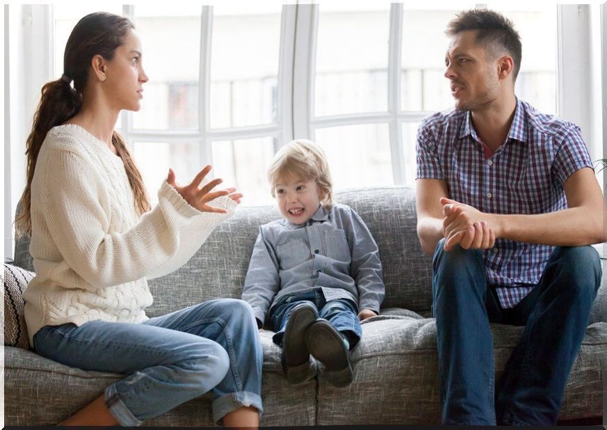 Couple argue in front of son.